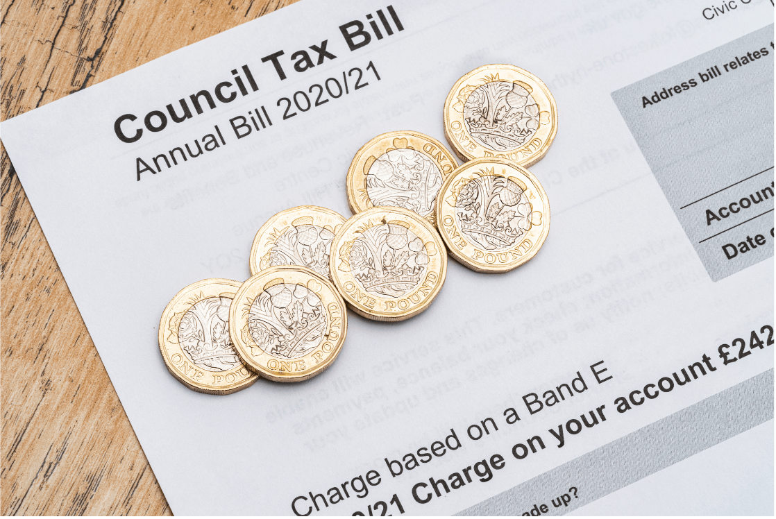 A council tax bill with coins on top of it