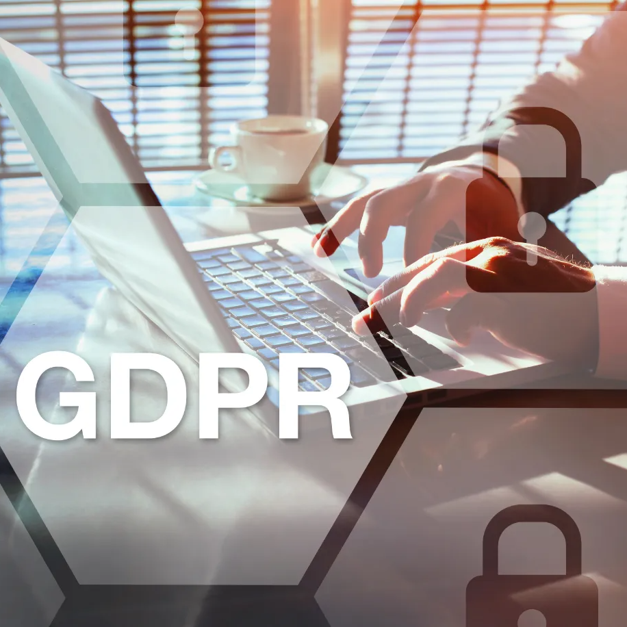 A person is typing on a laptop with the word gdpr written on the bottom