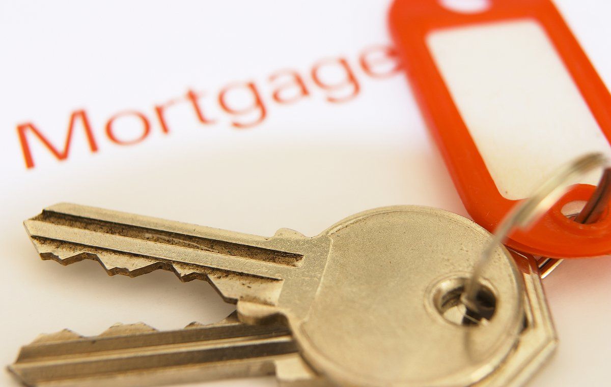 A pair of keys with a tag that says mortgage
